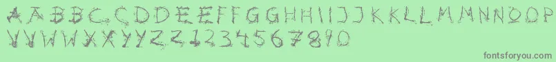 Hotsblots-fontti – harmaat kirjasimet vihreällä taustalla