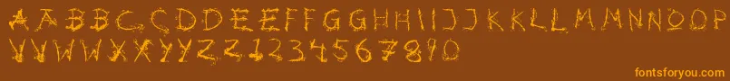 フォントHotsblots – オレンジ色の文字が茶色の背景にあります。