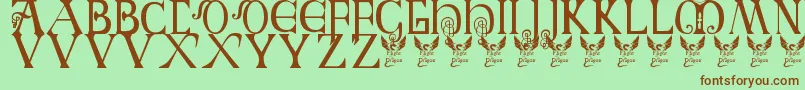 フォントBritishBlockFlourish10thC – 緑の背景に茶色のフォント