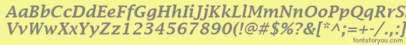LucidaFaxDemiboldItalic-fontti – harmaat kirjasimet keltaisella taustalla