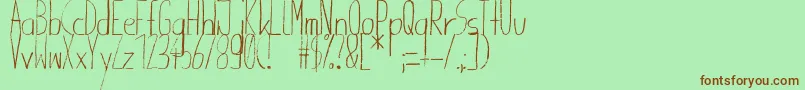 Giraffenhals-fontti – ruskeat fontit vihreällä taustalla