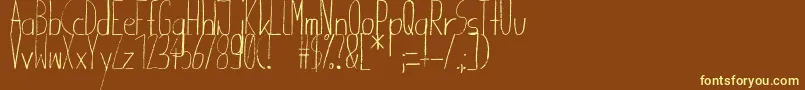 Giraffenhals-fontti – keltaiset fontit ruskealla taustalla