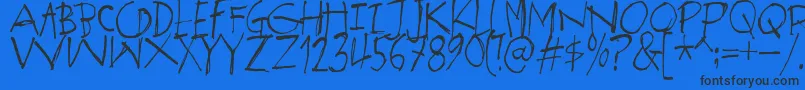 SpektakelDemo-fontti – mustat fontit sinisellä taustalla