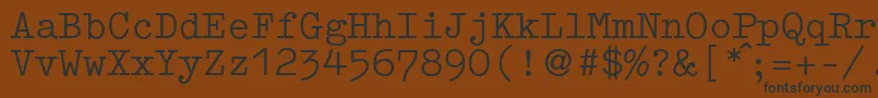 Fonte GermantypewriterRegular – fontes pretas em um fundo marrom