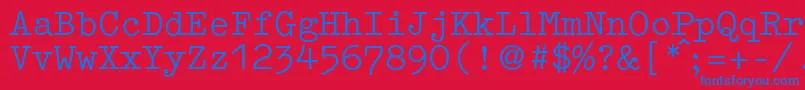 Czcionka GermantypewriterRegular – niebieskie czcionki na czerwonym tle