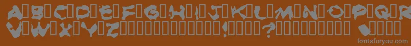 フォントBurnedRubberBlack – 茶色の背景に灰色の文字
