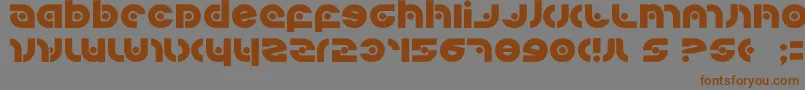 フォントKovacssp – 茶色の文字が灰色の背景にあります。
