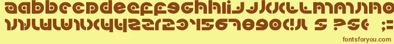 フォントKovacssp – 茶色の文字が黄色の背景にあります。