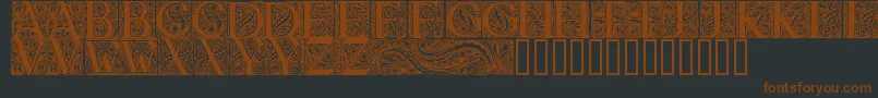 BehrensAntiquaInitialen-fontti – ruskeat fontit mustalla taustalla