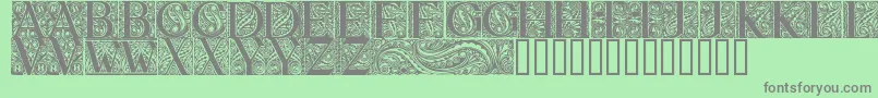 fuente BehrensAntiquaInitialen – Fuentes Grises Sobre Fondo Verde
