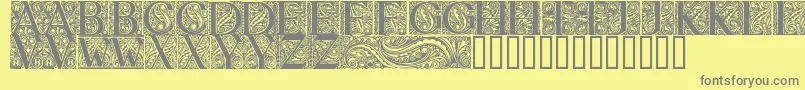 Fonte BehrensAntiquaInitialen – fontes cinzas em um fundo amarelo