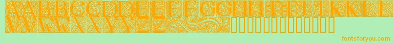 BehrensAntiquaInitialen-Schriftart – Orangefarbene Schriften auf grünem Hintergrund