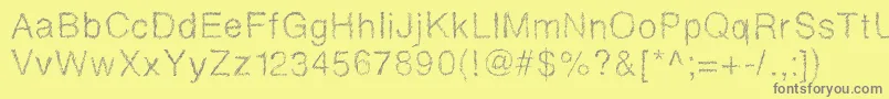 フォントDrawveticamini – 黄色の背景に灰色の文字