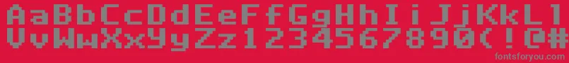 DeluxefontRegular Font – Gray Fonts on Red Background