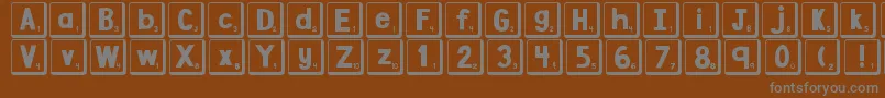 DjbLetterGameTiles2 Font – Gray Fonts on Brown Background