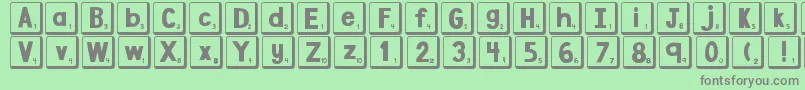 Fonte DjbLetterGameTiles2 – fontes cinzas em um fundo verde