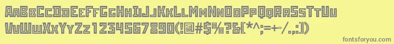 Rodchenkoinlineatt-fontti – harmaat kirjasimet keltaisella taustalla