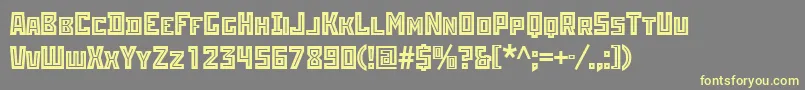 Шрифт Rodchenkoinlineatt – жёлтые шрифты на сером фоне