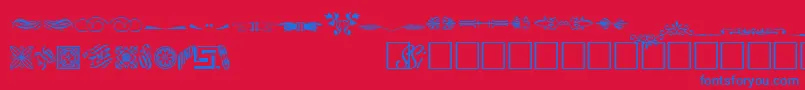 WoodcutornamentstwosskRegular-Schriftart – Blaue Schriften auf rotem Hintergrund