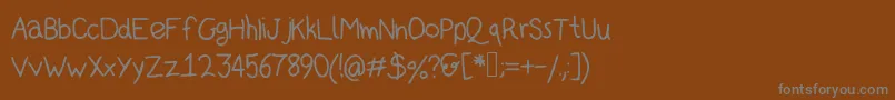 Kidsans Font – Gray Fonts on Brown Background