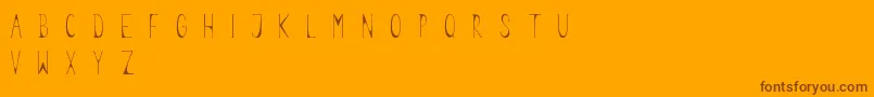 Legume-Schriftart – Braune Schriften auf orangefarbenem Hintergrund