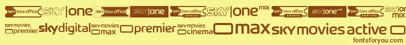 Шрифт SkyTvChannelLogos – коричневые шрифты на жёлтом фоне