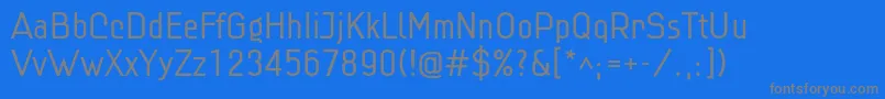 Linlig-fontti – harmaat kirjasimet sinisellä taustalla