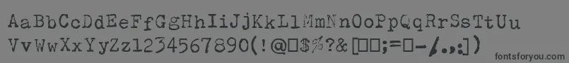 フォントOlivettiType2 – 黒い文字の灰色の背景