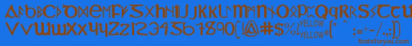 フォントYyUncialMostIrish – 茶色の文字が青い背景にあります。