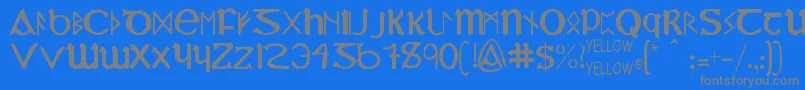 フォントYyUncialMostIrish – 青い背景に灰色の文字