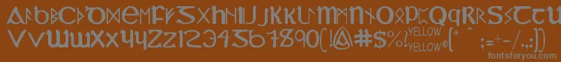 フォントYyUncialMostIrish – 茶色の背景に灰色の文字