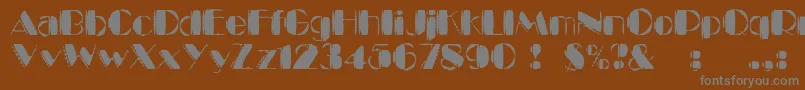 KaptinTribbleWound-Schriftart – Graue Schriften auf braunem Hintergrund