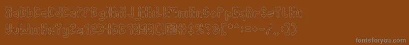 Czcionka AntiqueRetroHollow – szare czcionki na brązowym tle