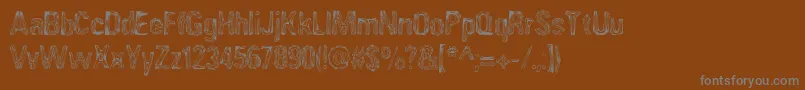 AngiomaAoe-Schriftart – Graue Schriften auf braunem Hintergrund