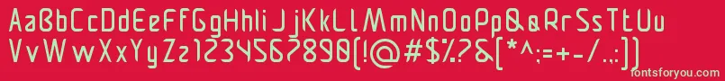 Pamekasanr-Schriftart – Grüne Schriften auf rotem Hintergrund