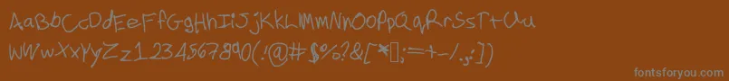 Cookielove-fontti – harmaat kirjasimet ruskealla taustalla