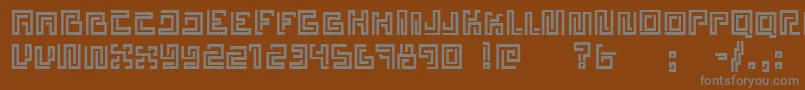 Estelar-fontti – harmaat kirjasimet ruskealla taustalla