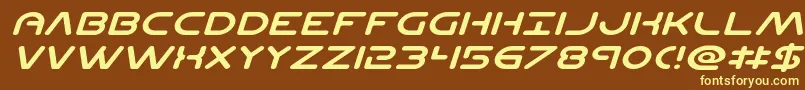 Planetncompactexpandital-fontti – keltaiset fontit ruskealla taustalla