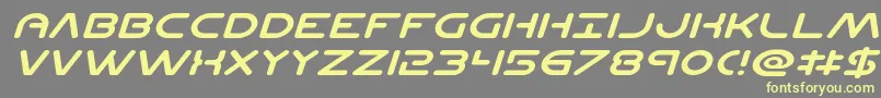 Planetncompactexpandital Font – Yellow Fonts on Gray Background