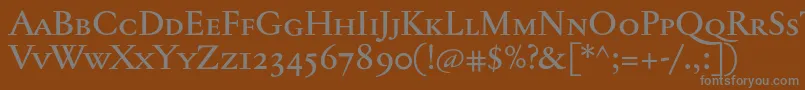 Jannontextmedsc-fontti – harmaat kirjasimet ruskealla taustalla