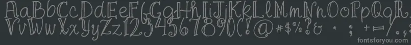 FgaprilTrial-fontti – harmaat kirjasimet mustalla taustalla