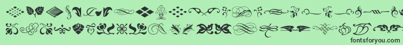 fuente TypeEmbellishmentsOneLetPlain.1.0 – Fuentes Negras Sobre Fondo Verde