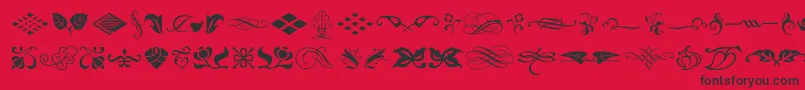 TypeEmbellishmentsOneLetPlain.1.0-fontti – mustat fontit punaisella taustalla