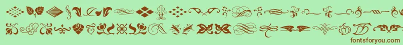 Weitere Informationen zur TypeEmbellishmentsOneLetPlain.1.0-Schriftart TypeEmbellishmentsOneLetPlain.1.0-Schriftart – Braune Schriften auf grünem Hintergrund