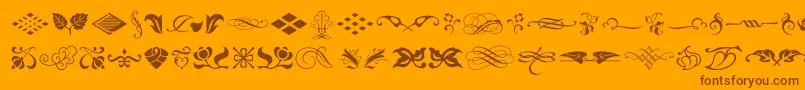 Más sobre la fuente TypeEmbellishmentsOneLetPlain.1.0 fuente TypeEmbellishmentsOneLetPlain.1.0 – Fuentes Marrones Sobre Fondo Naranja