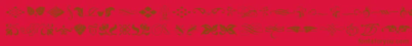 fuente TypeEmbellishmentsOneLetPlain.1.0 – Fuentes Marrones Sobre Fondo Rojo