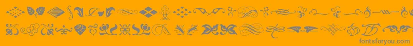 fuente TypeEmbellishmentsOneLetPlain.1.0 – Fuentes Grises Sobre Fondo Naranja