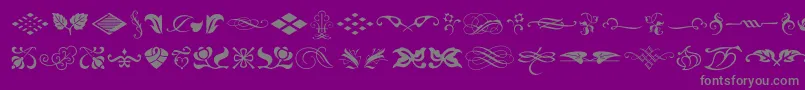 fuente TypeEmbellishmentsOneLetPlain.1.0 – Fuentes Grises Sobre Fondo Morado