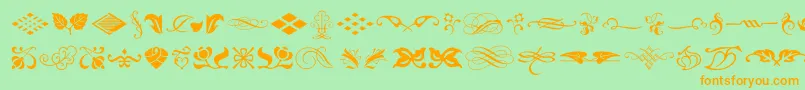 Czcionka TypeEmbellishmentsOneLetPlain.1.0 – pomarańczowe czcionki na zielonym tle