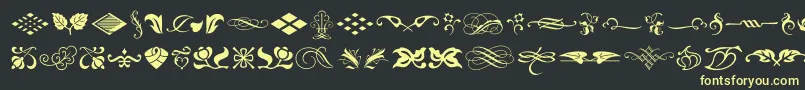 TypeEmbellishmentsOneLetPlain.1.0 Font – Yellow Fonts on Black Background